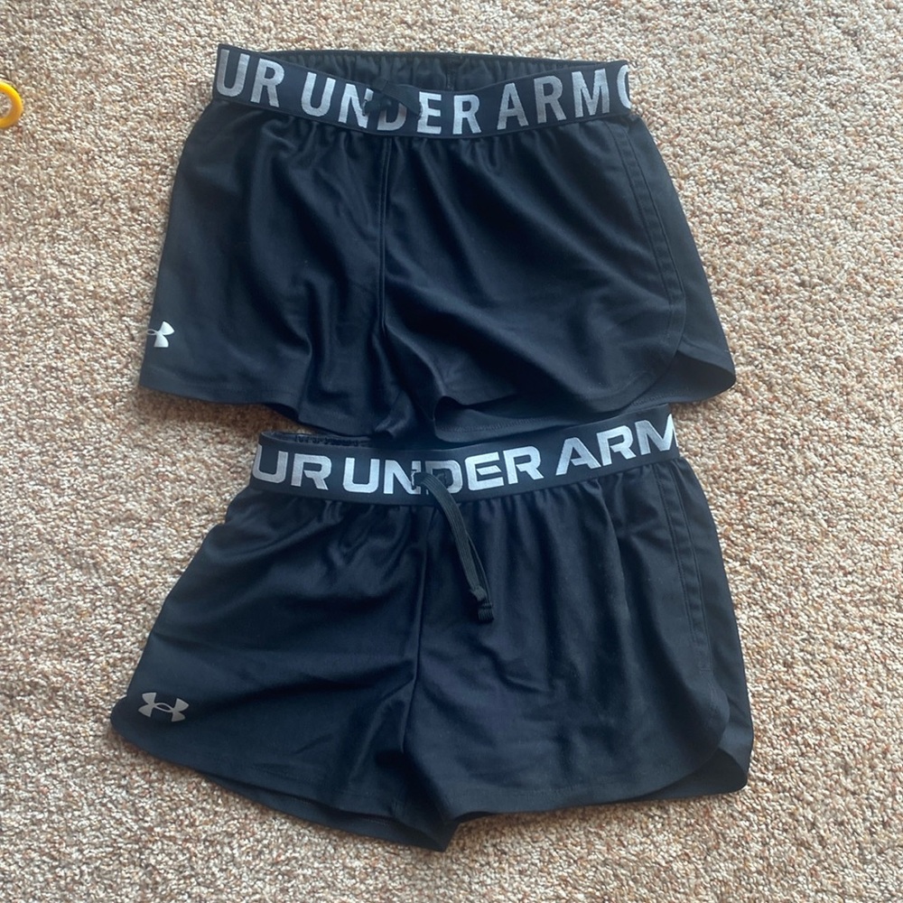 Girls youth size medium black under armour shorts. 2 pairs.